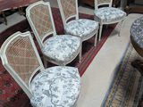 six chairs that are sitting on a rug in a room