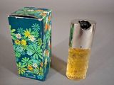 a bottle of perfume sitting next to a box of perfume