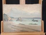 a painting of a beach scene on a easel