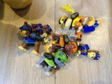 a lot of legos sitting on the floor next to an orange