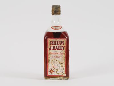 an image of a bottle of alcohol sitting on top of a white surface