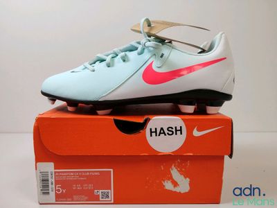 a pair of shoes that are on top of a box