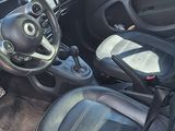 a small car with the door open and the interior of it