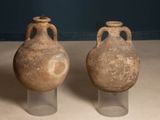 two vases that are sitting on a table