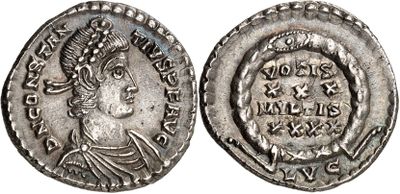 a silver coin with an image of a woman on it