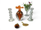 a group of glass vases and figurines sitting on a table