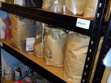 many bags of food on the shelves in the pantry