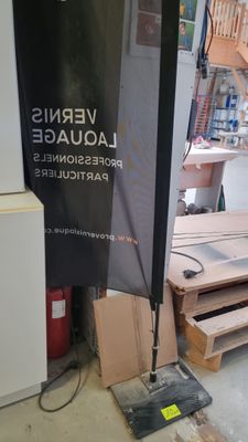 a picture of a sign in a shop with a lot of boxes