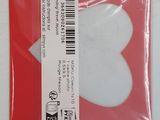a white heart shaped object in a plastic bag