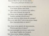 a poem written in french on a piece of paper