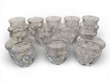 a group of glass vases sitting on a white surface