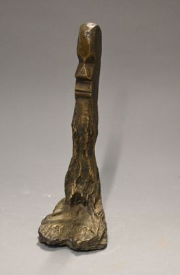 bronze statue of a foot with a bird ' s head on it