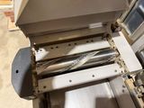 an image of a machine that has a roll of paper in it