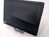 a tablet computer sitting on a stand on a white surface