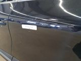 a black car with a sticker on the side of it