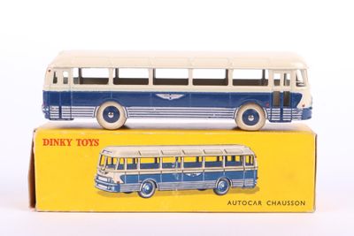 a blue and white toy bus sitting on top of a yellow box