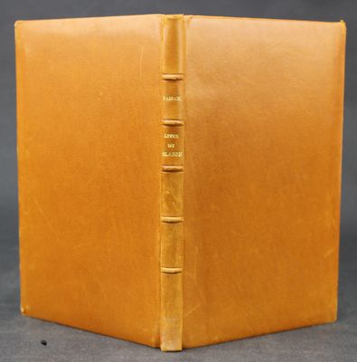 an old book with a brown cover and a gold binding