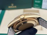 a watch that is being held up by a glove