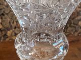 a glass vase that is sitting on a table