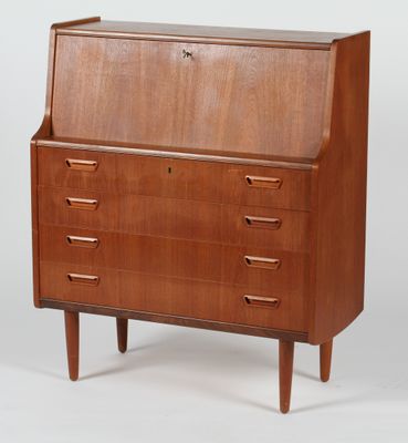a mid - century danish teak secretary ' s desk with four drawers