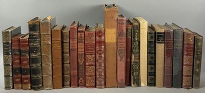 a lot of old books that are stacked on top of each other