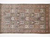 an antique persian rug with a floral design and fringe fringes