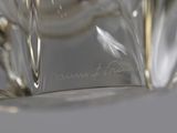 a close up of a glass vase on a table