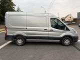 a silver van that is parked in a parking lot
