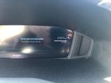 the dashboard of a car with a digital display on it