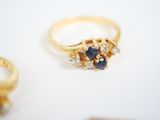 a gold ring with blue and white stones on it