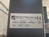 a label on the back of a machine that is sitting on a table