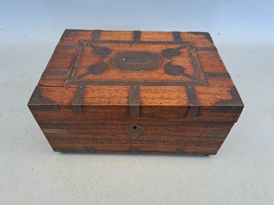 an old wooden box sitting on top of a white table
