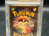 a close up of a pokemon card in a clear case