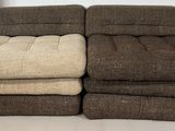 two couches that are sitting next to each other