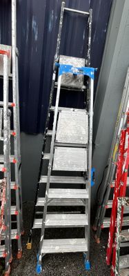many ladders that are lined up against the wall