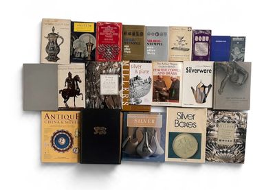 a lot of books that are stacked on top of each other