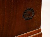 a close up of a wooden table with a clock on it