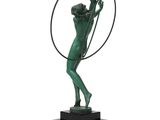 art deco bronze sculpture of a woman holding a hoop