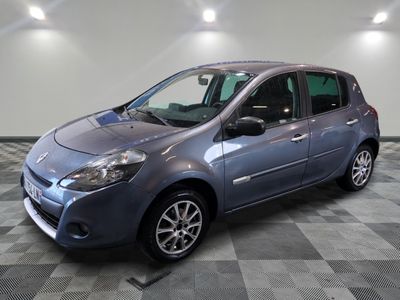 a picture of a small blue car parked in a garage