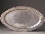 a silver plate that is sitting on a table