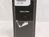 the back of a black samsung z flip case with a barcode on it