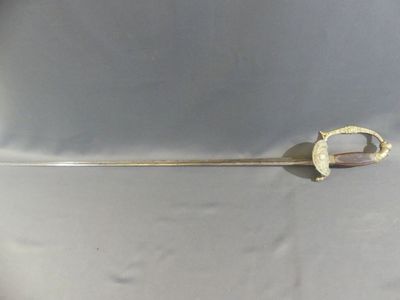 a close up of a metal object on a white surface