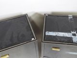 pair of black and gold nightstands with marble top and brass handles