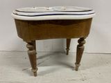a small wooden table with a sink on it