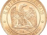 a close up of a gold coin with an eagle on it
