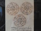 an image of a picture of four medallions on a piece of paper