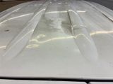 a close up of the hood of a car that has been painted white