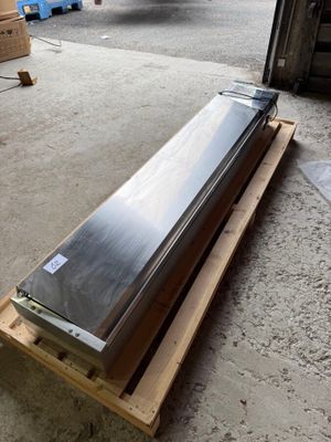 an image of a refrigerator sitting on a pallet in a warehouse