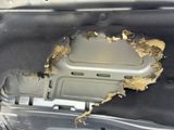 a hole in the trunk of a car that has been damaged