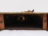 a small wooden box with a bird sitting on top of it